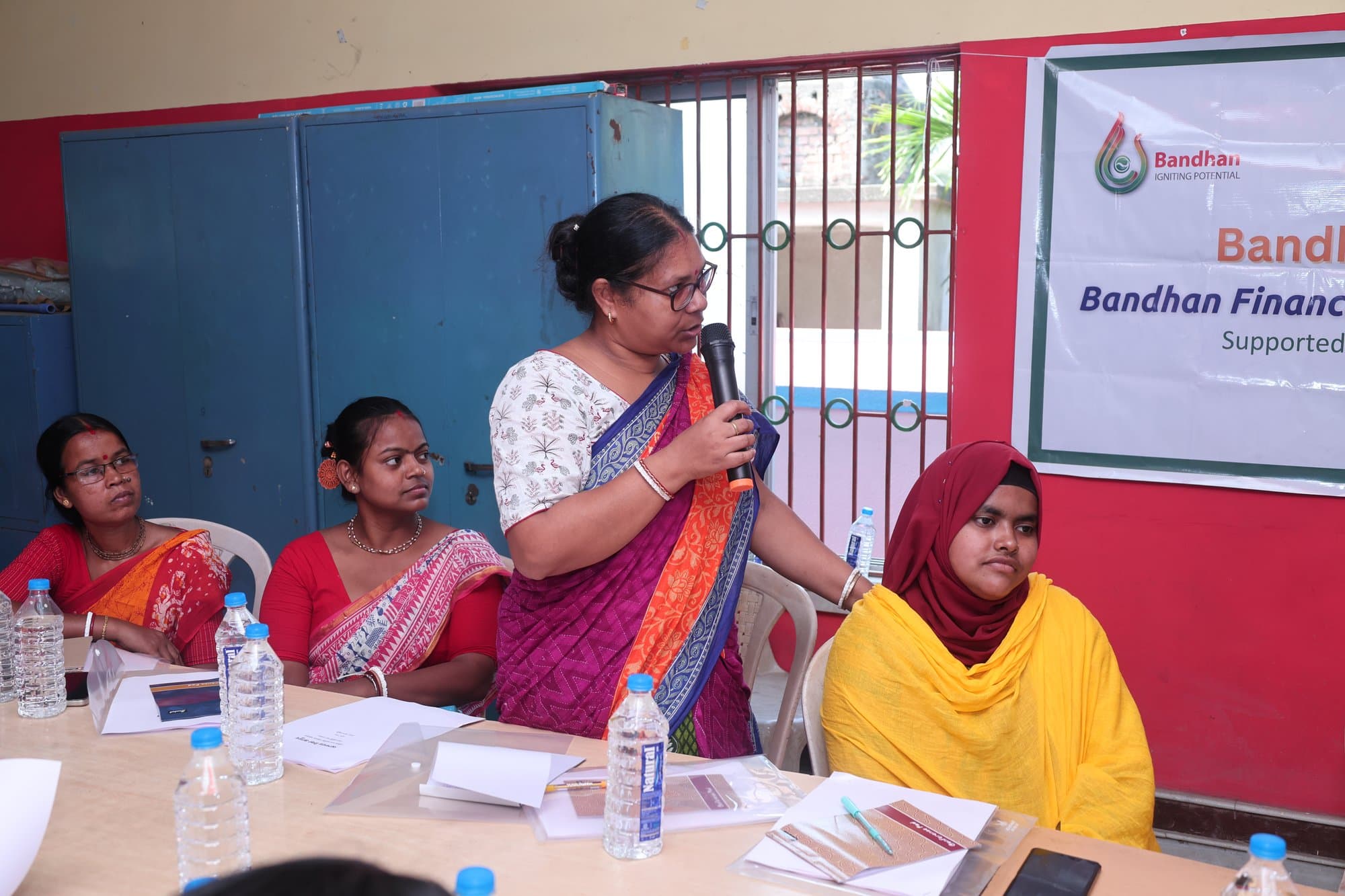 A participant standing to speak during the session