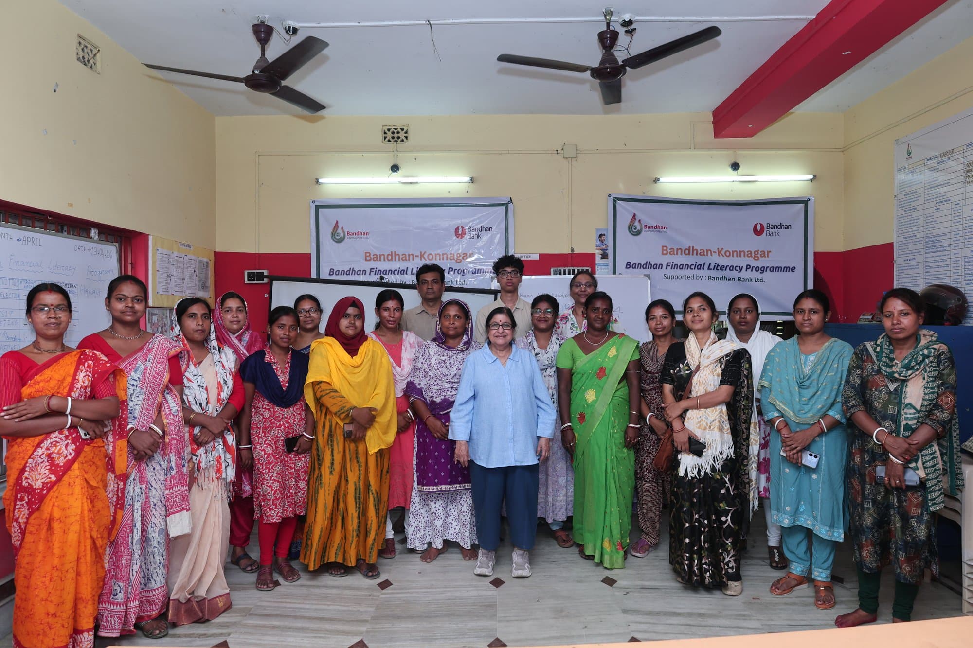 The full cohort together under the programme banner