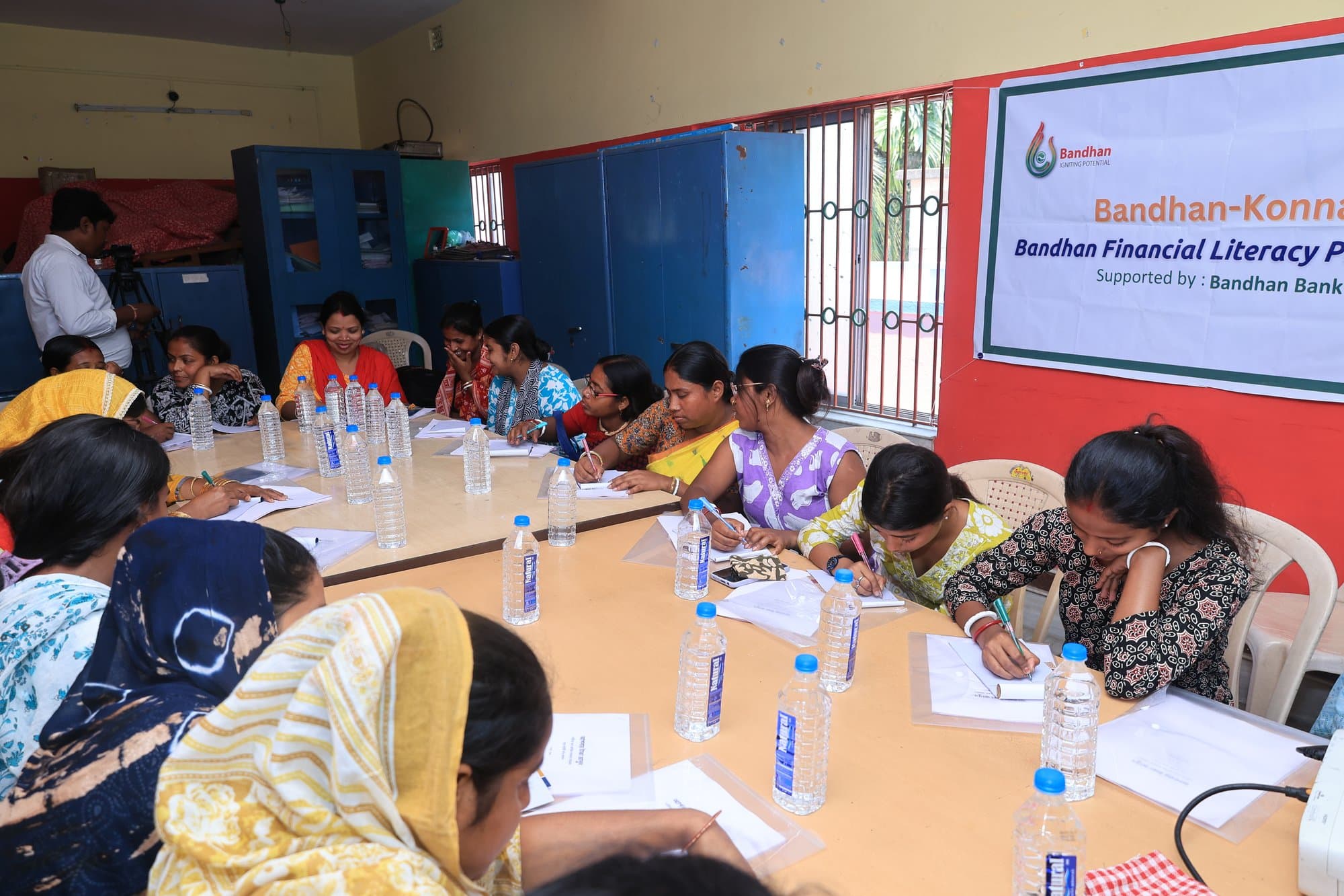Participants writing in their worksheets during a session