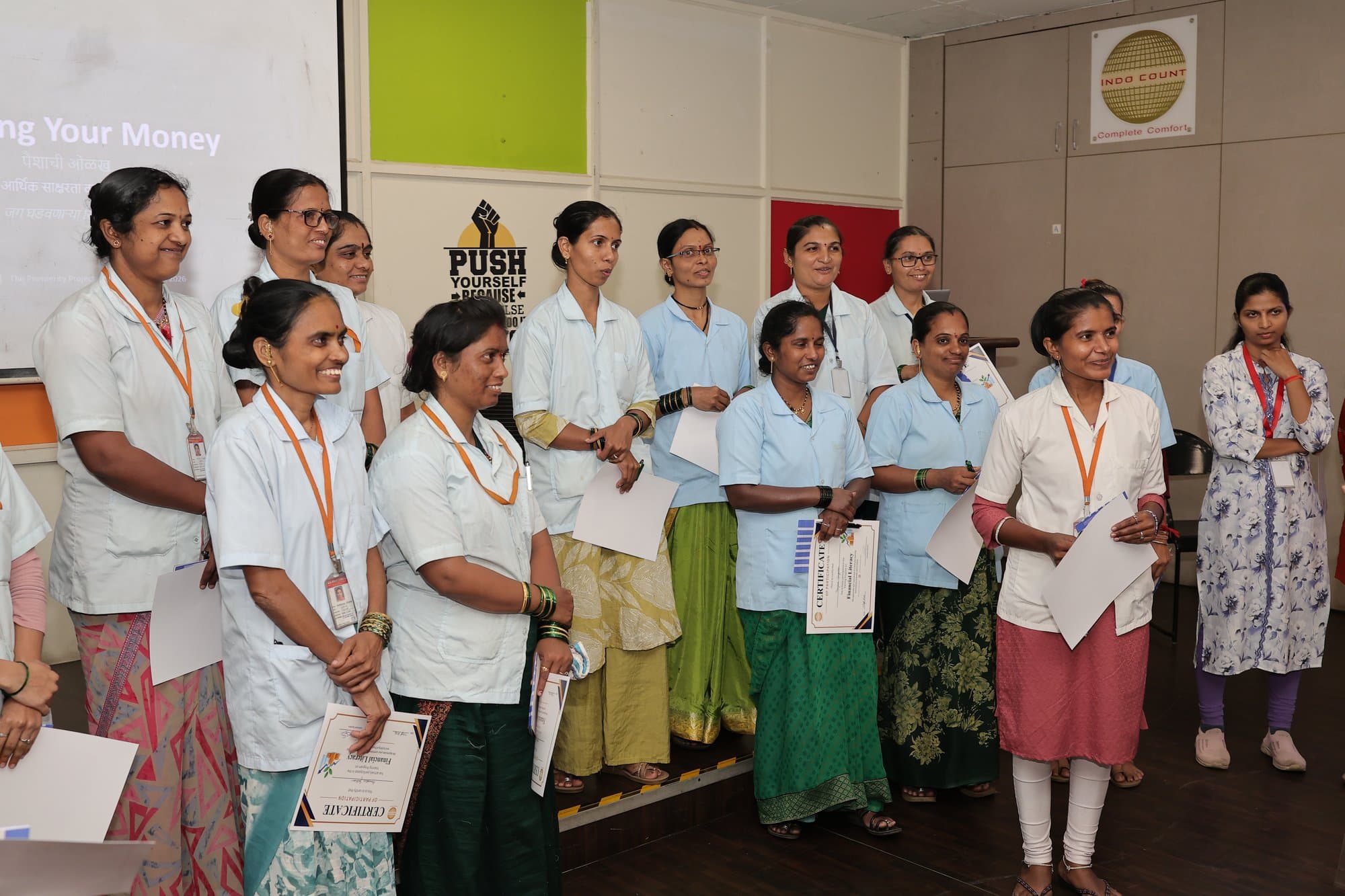 Participants in Kolhapur standing in a row with their certificates