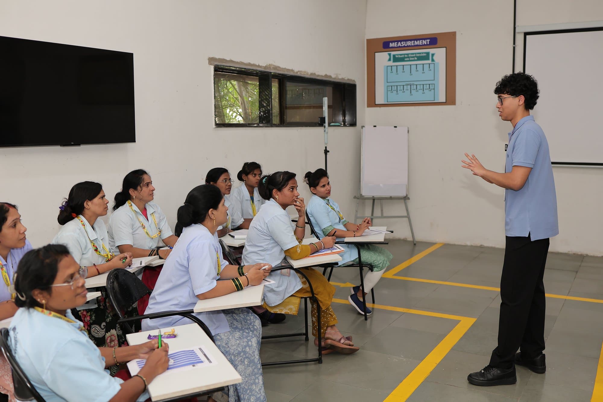 A workshop in session at Indo Count's training centre in Kolhapur, the group at their desks