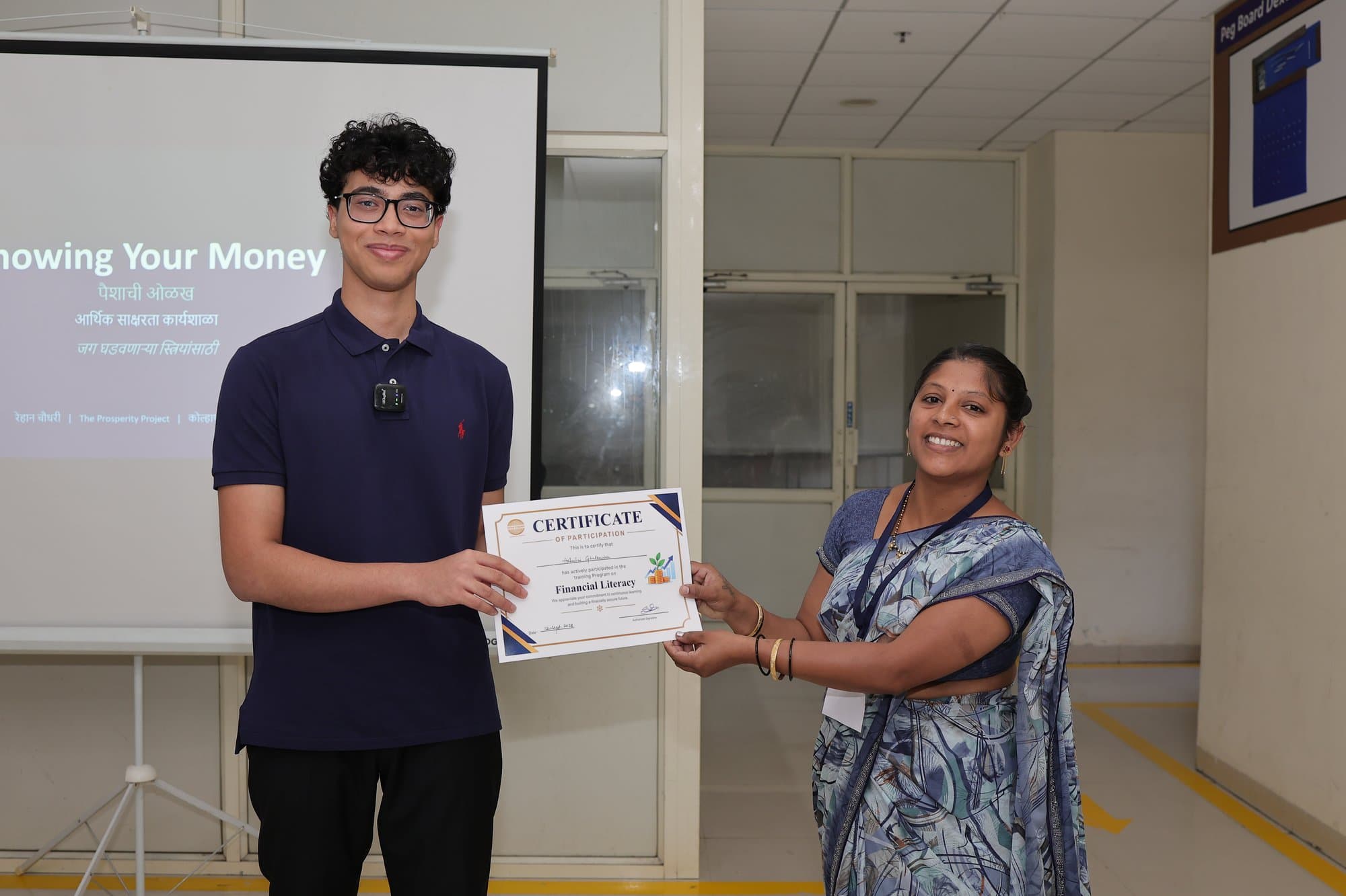 A participant receiving her certificate of participation