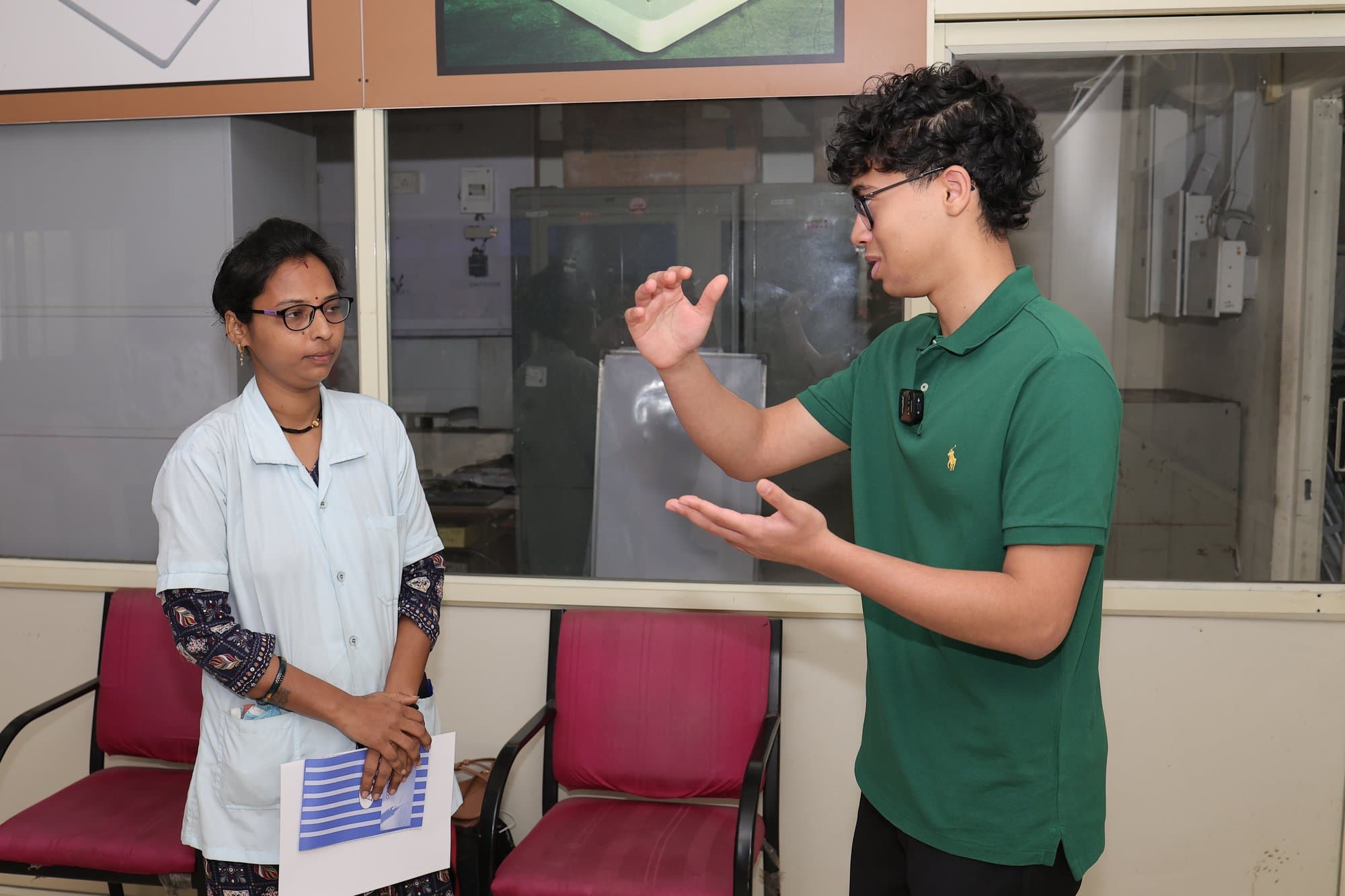 The founder answering a participant's question beside her desk