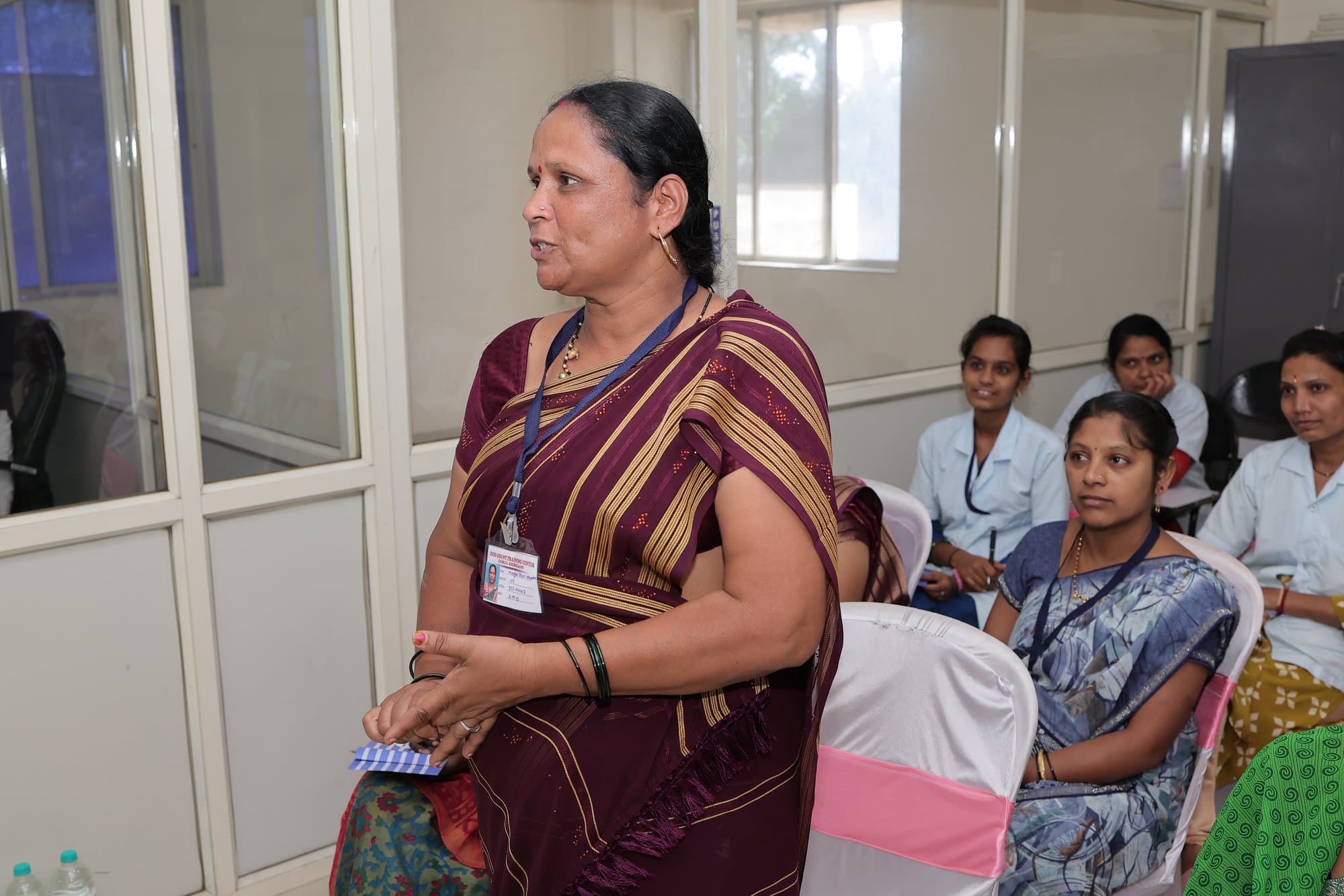 A participant standing to speak during the session