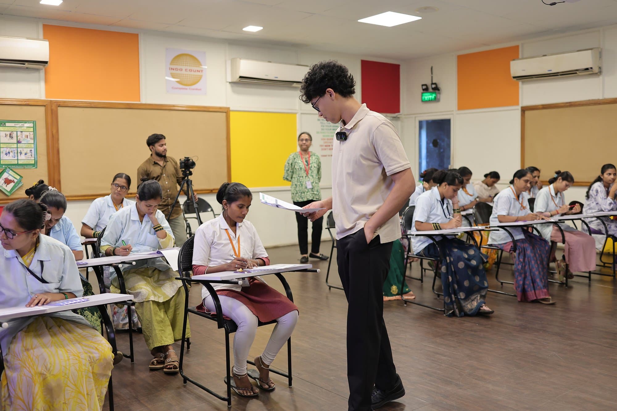 The founder walking between the desks during an exercise