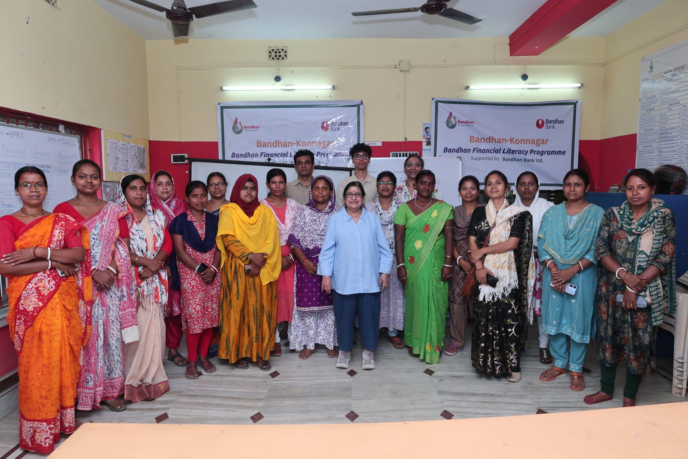 The full cohort gathered together under the programme banner